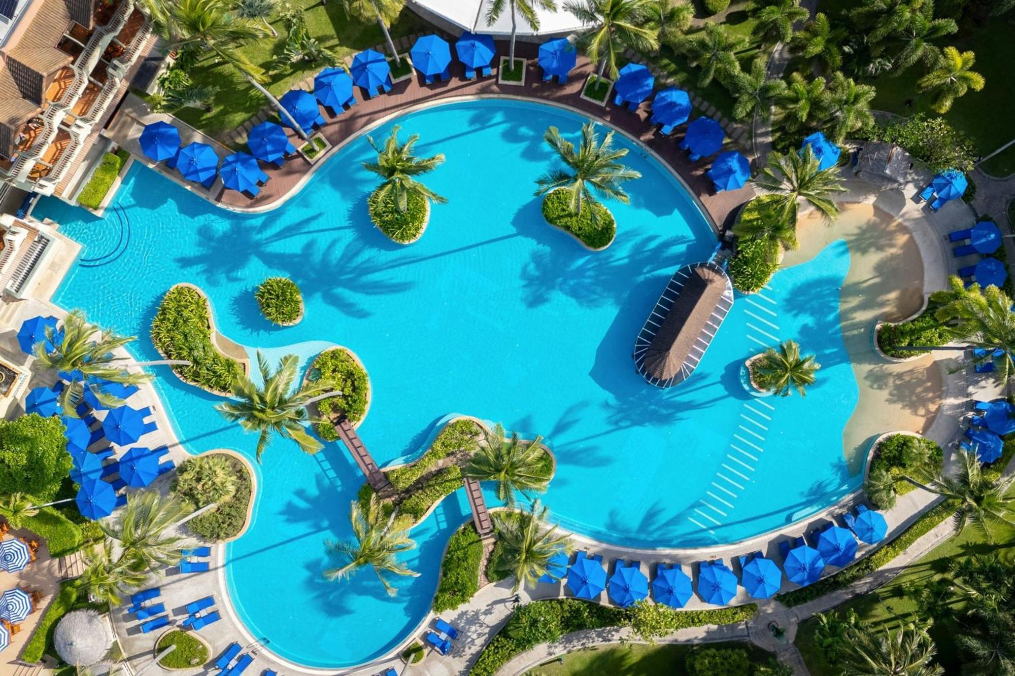 Phuket Marriott Resort & Spa, Merlin Beach Patong Exterior photo Aerial view of the pool at the Hilton Mauritius Resort